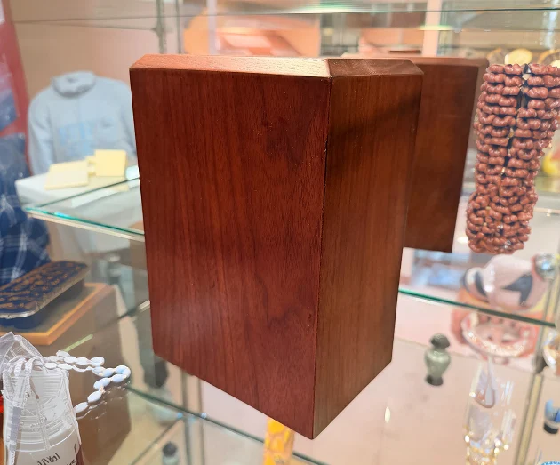 Rectangular wooden cremation urn box.
